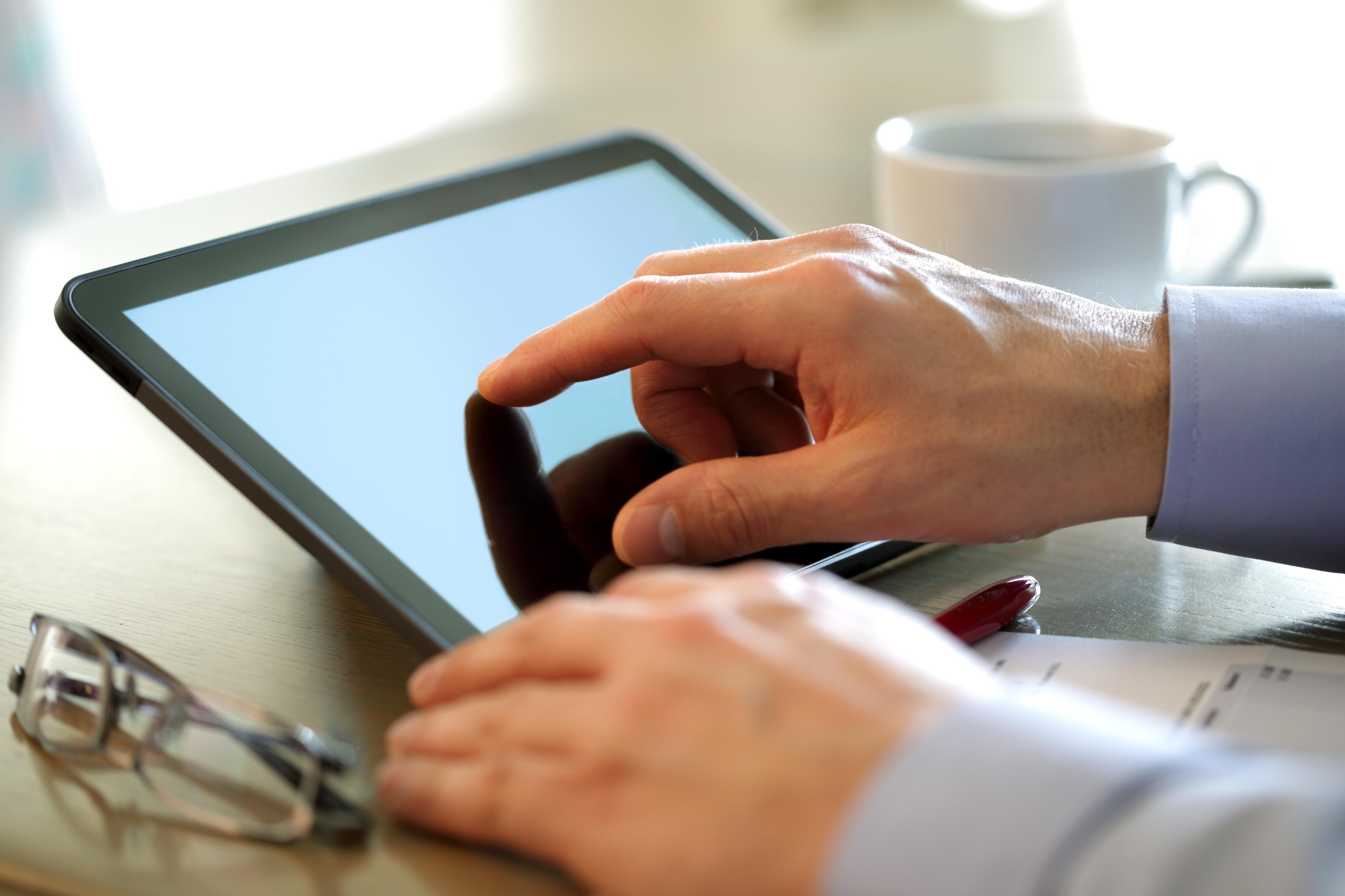 Office - Businessman using a tablet